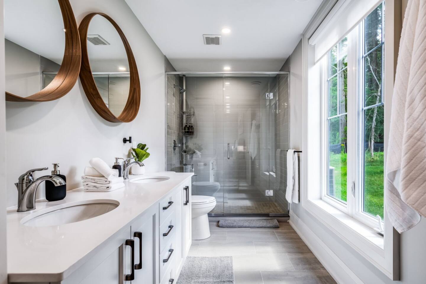 A private ensuite with a walk-in shower and double vanity for effortless mornings. Main Floor King Master