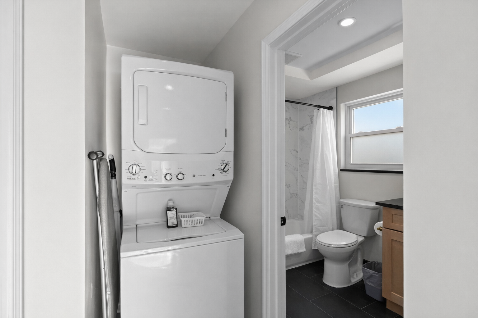 Convenient in-unit laundry paired with a bright, modern bathroom—making everyday routines easy, comfortable, and stress-free during your stay.