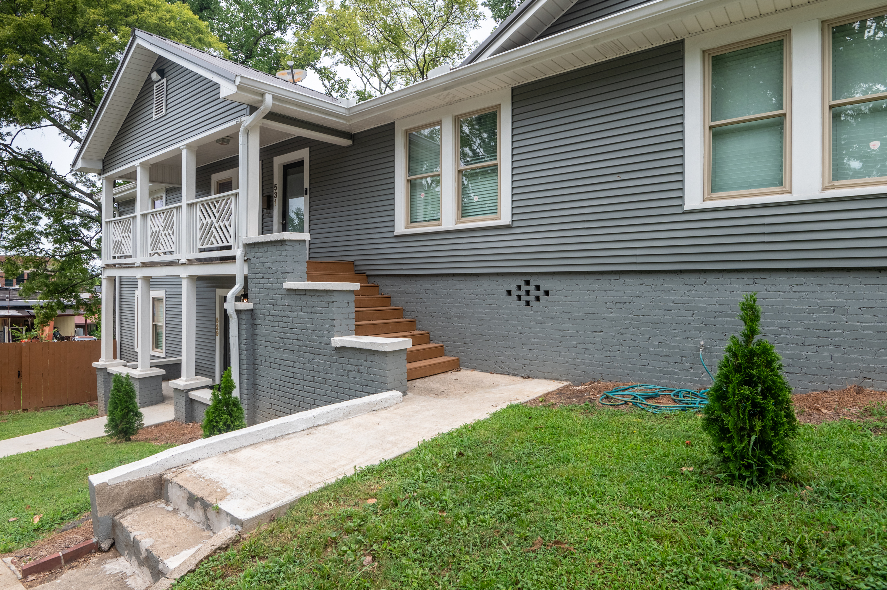 Walkway to the front door. You can park anywhere on the street and use this sidewalk, then go up the stairs to the front door.