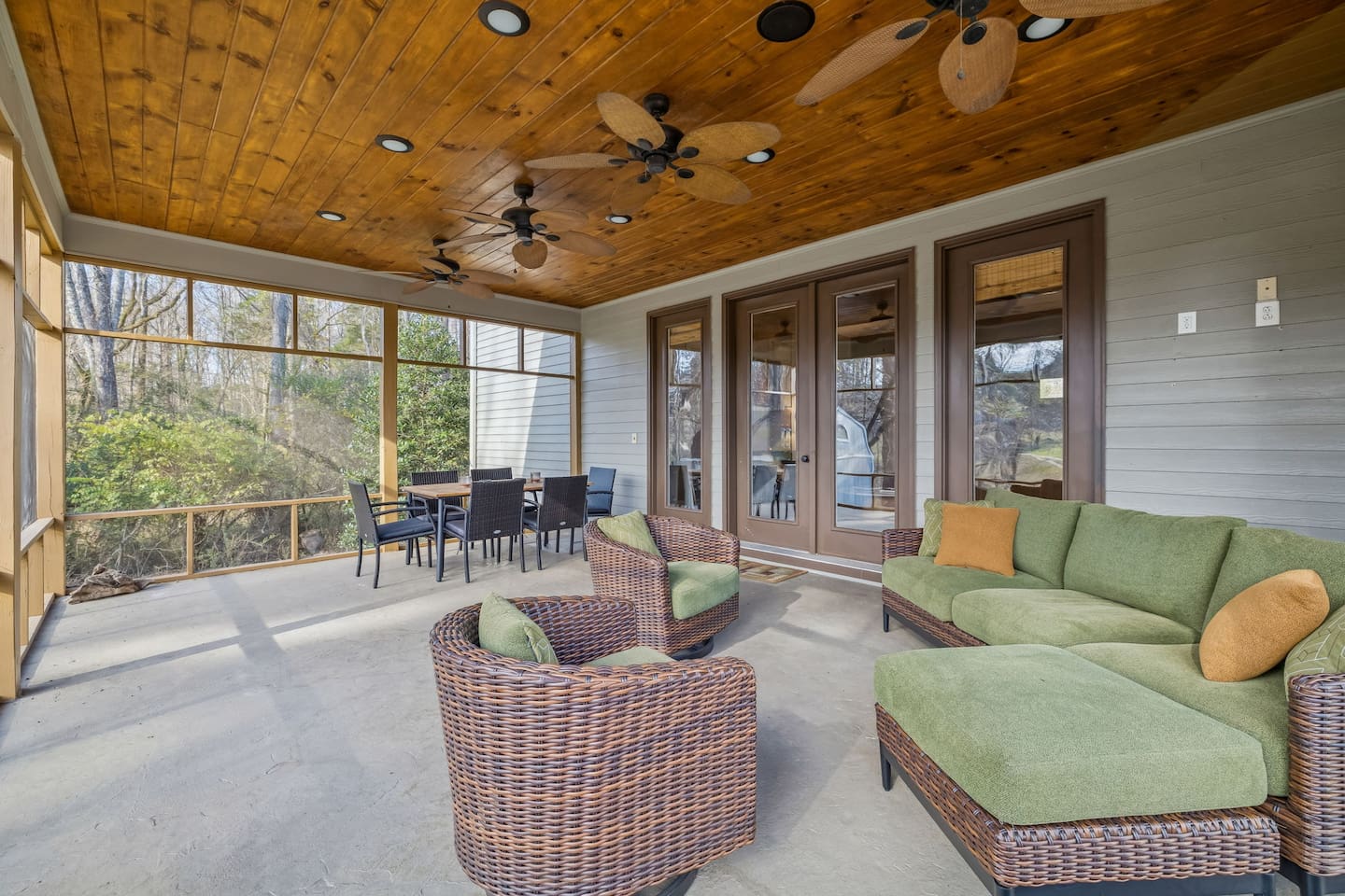 The Screen Porch is right outside the living room with dining and lounging.