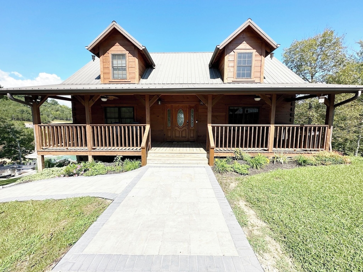 When you first arrive you have nice wide walkway to the front porch (with some Rocking chairs) and front door  or you can turn to the left and walk on the patios to around the back patios and back porches