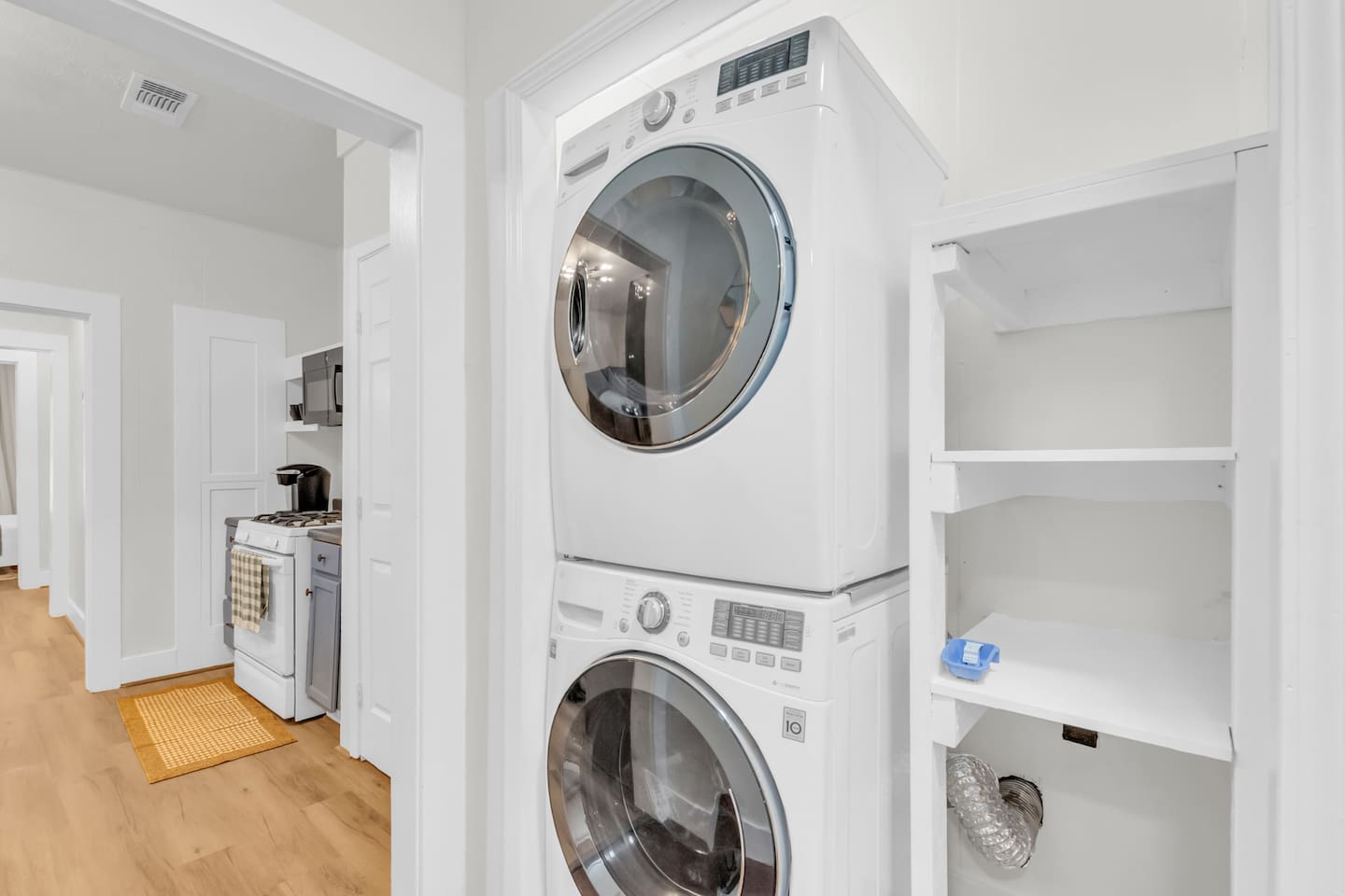 Laundry room with washer and dryer for guest convenience.