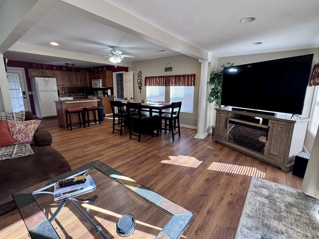 Open-concept living room, kitchen, and dining room.
