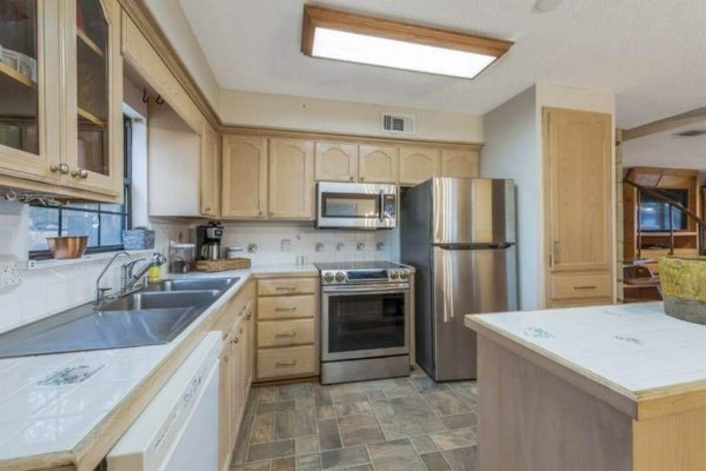 The kitchen at Larkspur Lodge is fully stocked and ready for your family feasts! Enjoy modern appliances, cookware, pots, pans, dishes, silverware, and all the essentials you need to prepare and serve delicious home-cooked meals with ease. 