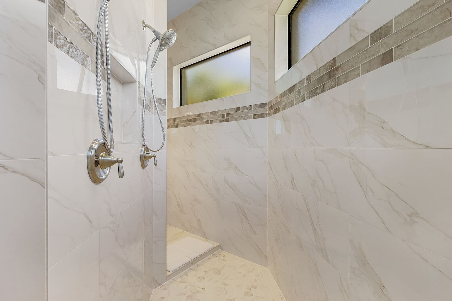 Experience luxury in the primary ensuite bathroom featuring a spacious walk-in shower!