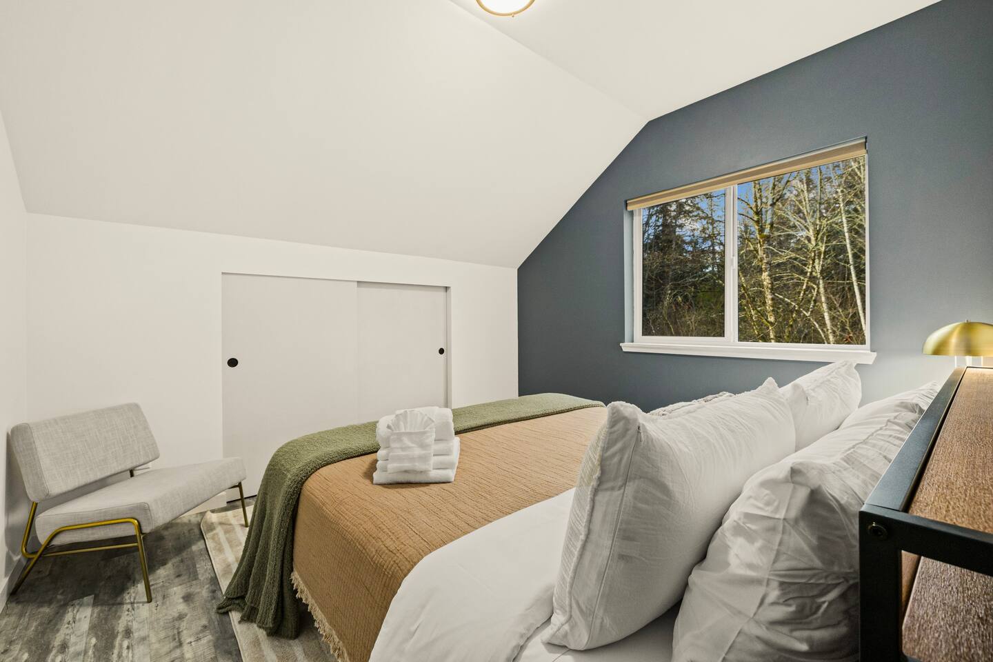Bedroom #2 has a another king-sized bed with a view of the backyard 