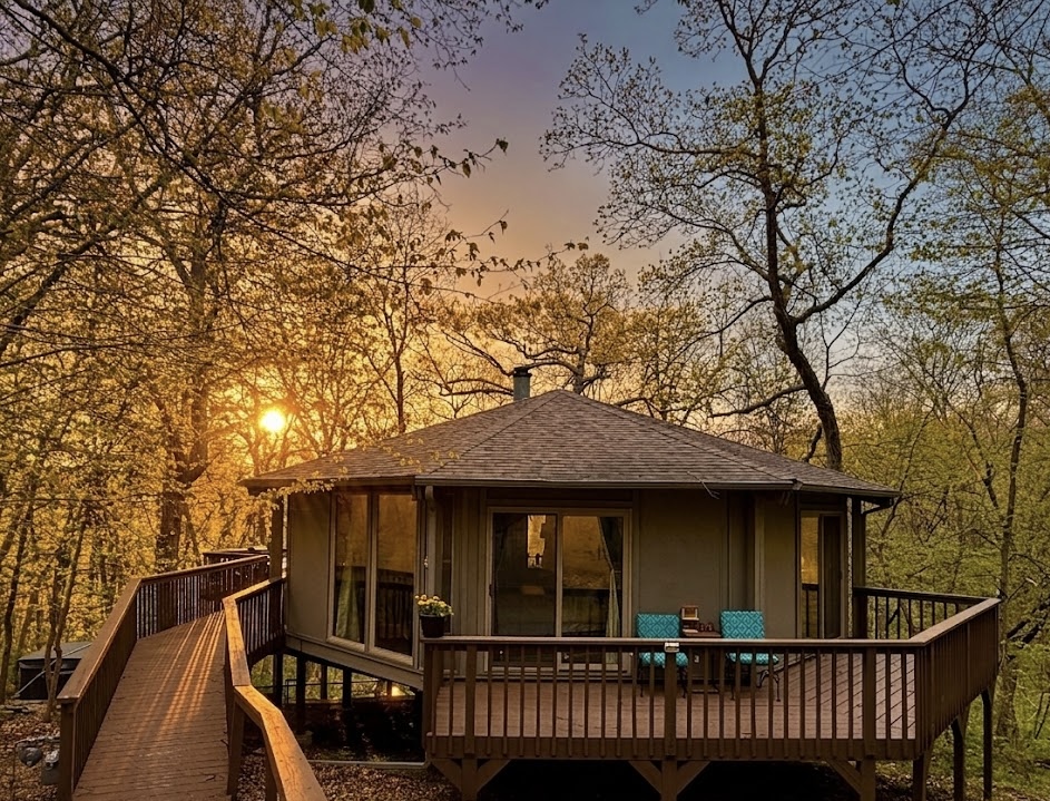Unique octagon treehouse, with wrap around porch to relax on!