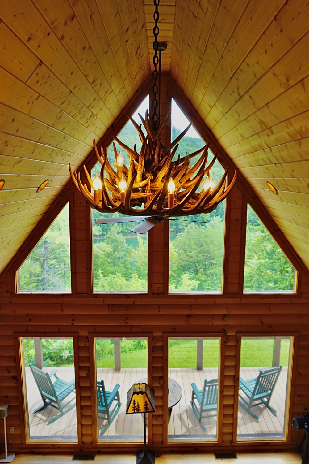 Great Room: Stunning views and rustic charm with a unique antler chandelier hanging above!