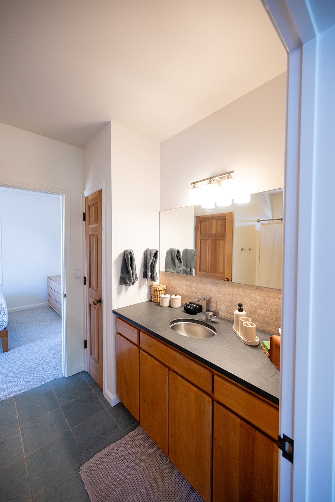 Clean and well maintained bathroom with fresh towels and essential amenities