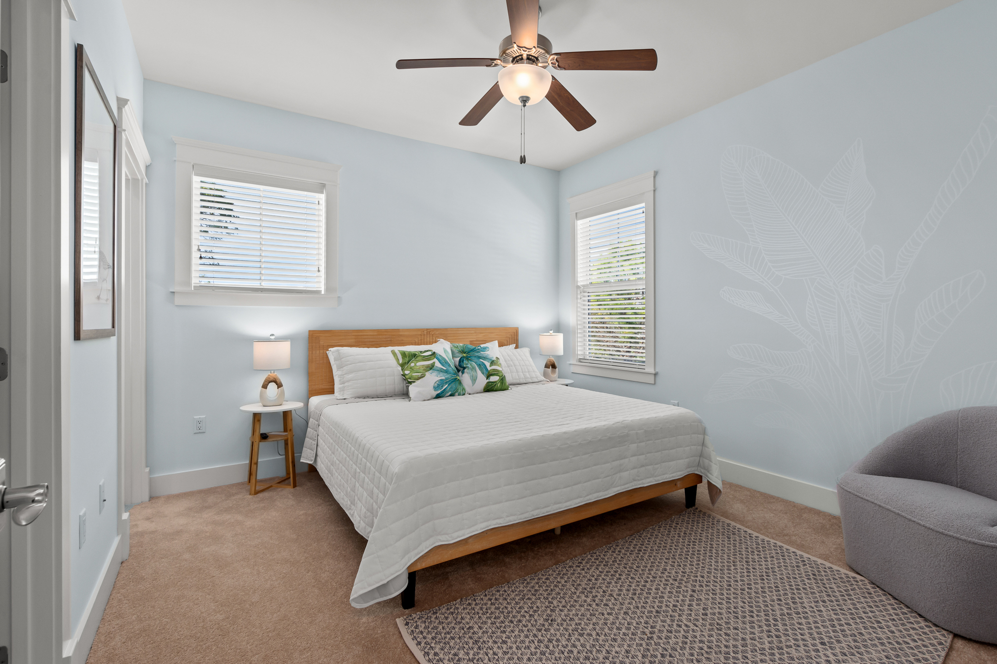 Light, comfort, and a touch of tropical make this room a haven.