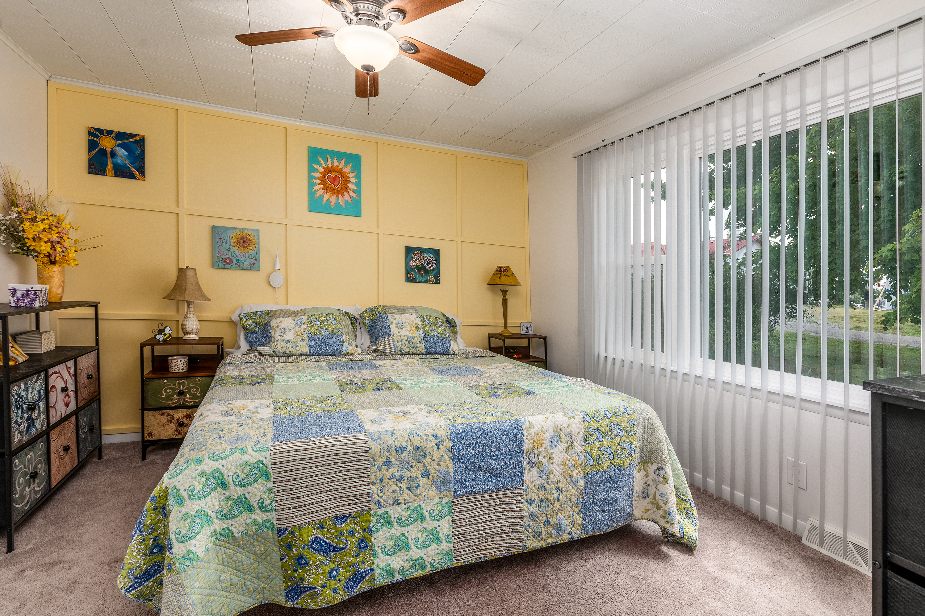 Bedroom 1: This king bed, soft lighting, and cozy touches make winding down a breeze.