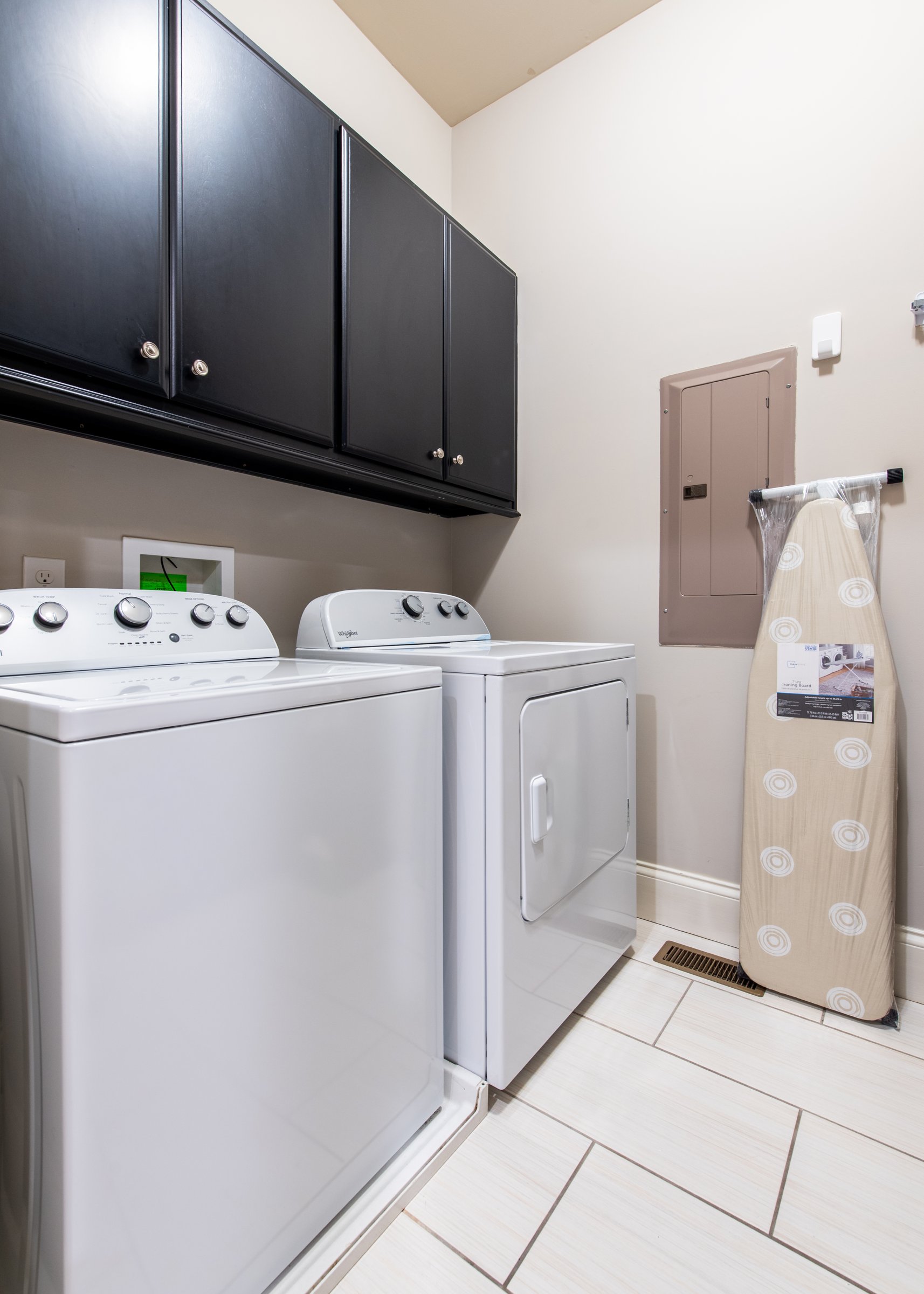 In-unit washer and dryer with cabinet storage - no laundromat runs needed.
