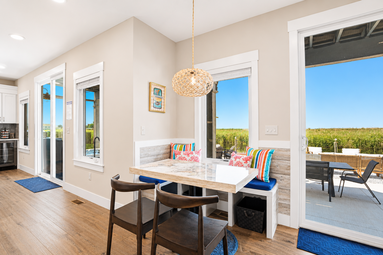 With patio access just steps away, this inviting dining space is perfect for family dinners, game nights, or enjoying fresh lake breezes between meals.