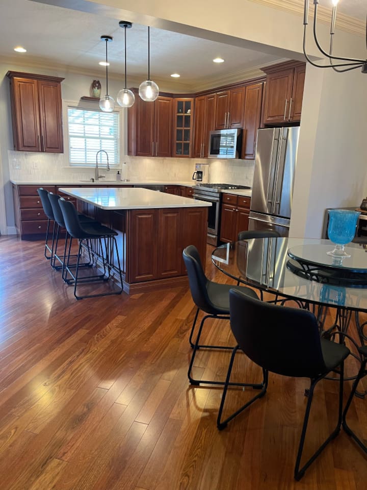Open dining area with a clear view of the kitchen, creating a seamless flow between both spaces for easy meals and socializing.