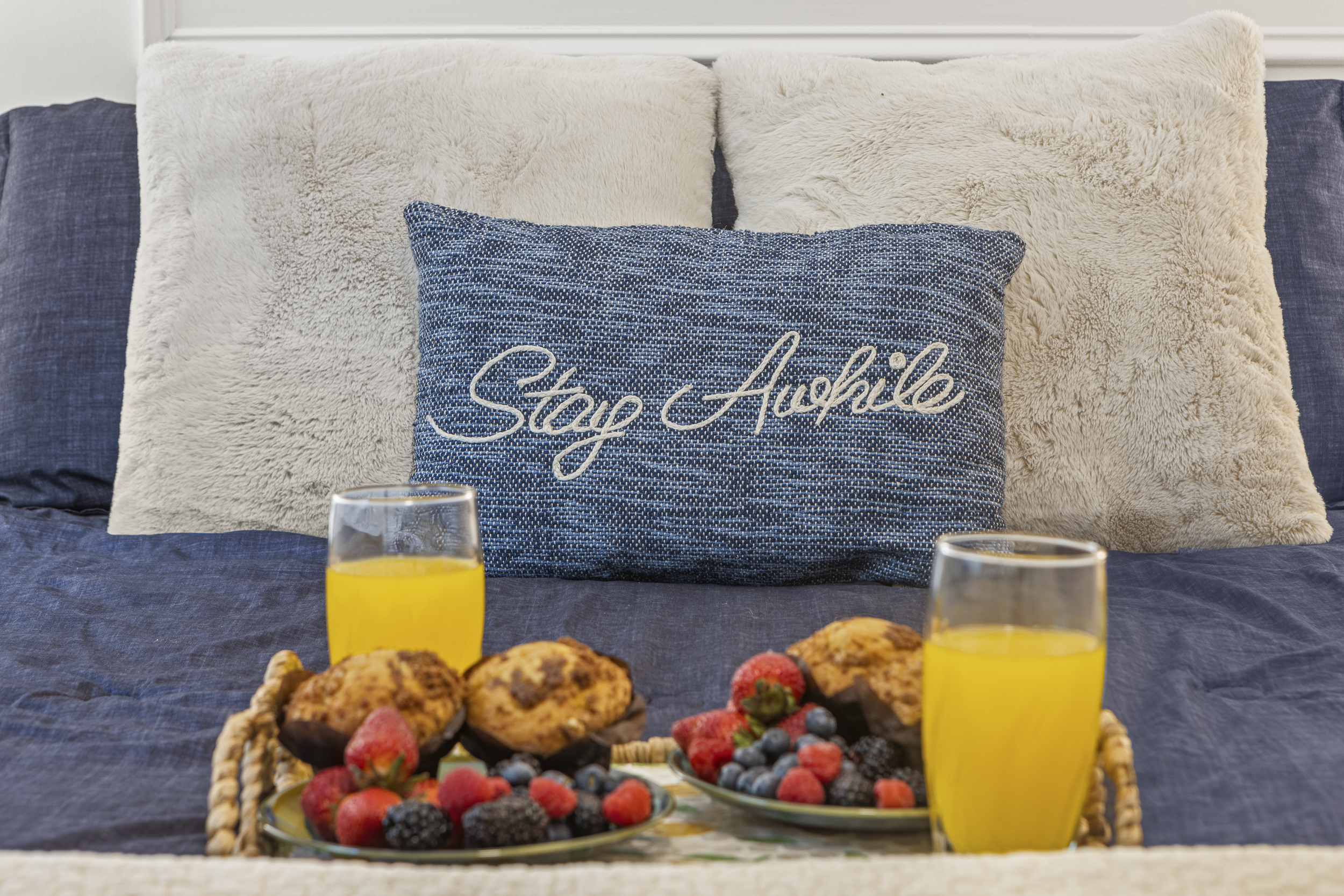 Queen Bedroom 2: Relax amidst plush pillows and fresh fruit, a perfect start to your getaway!