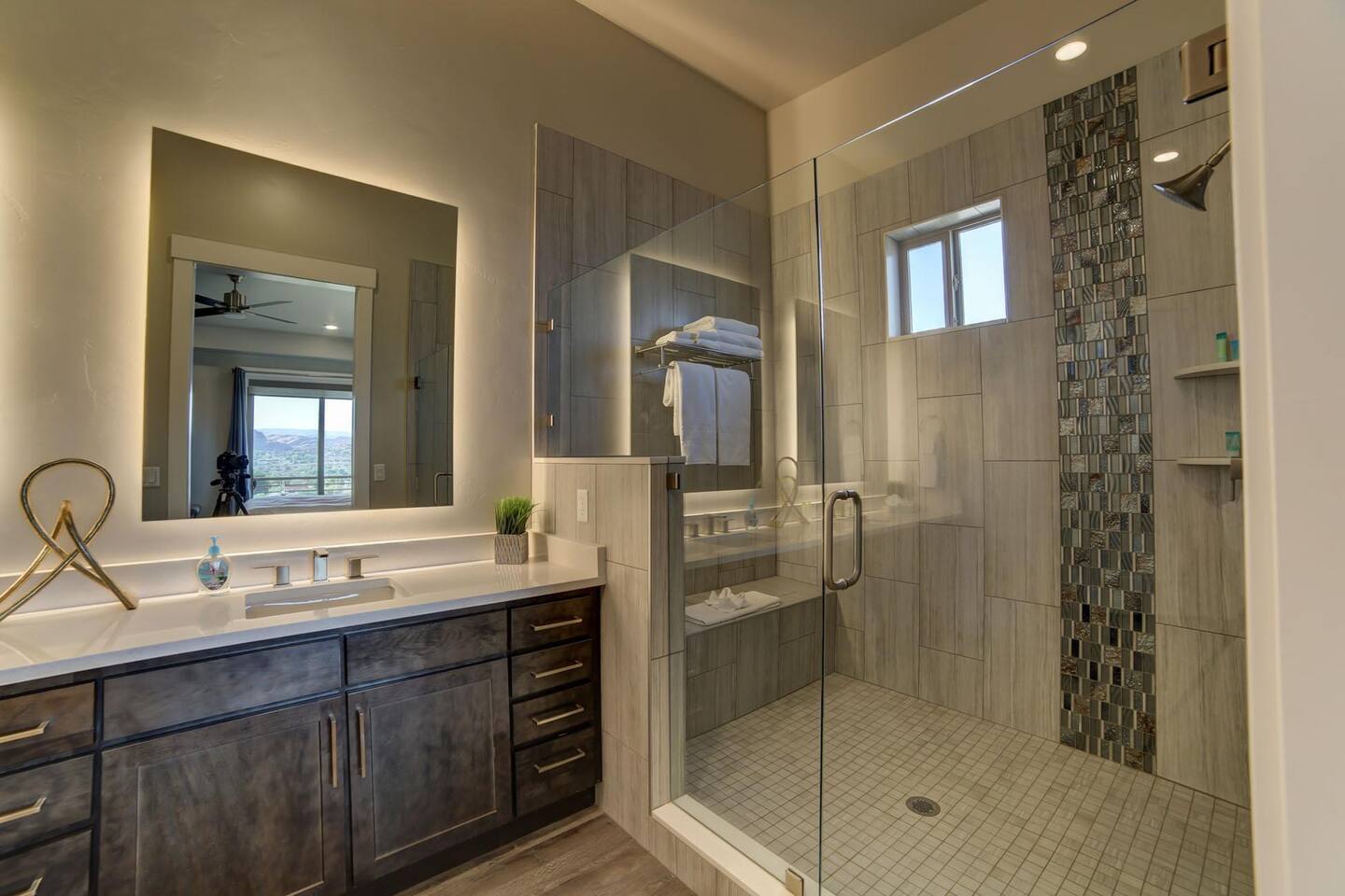 Master bathroom with dual sinks and large shower