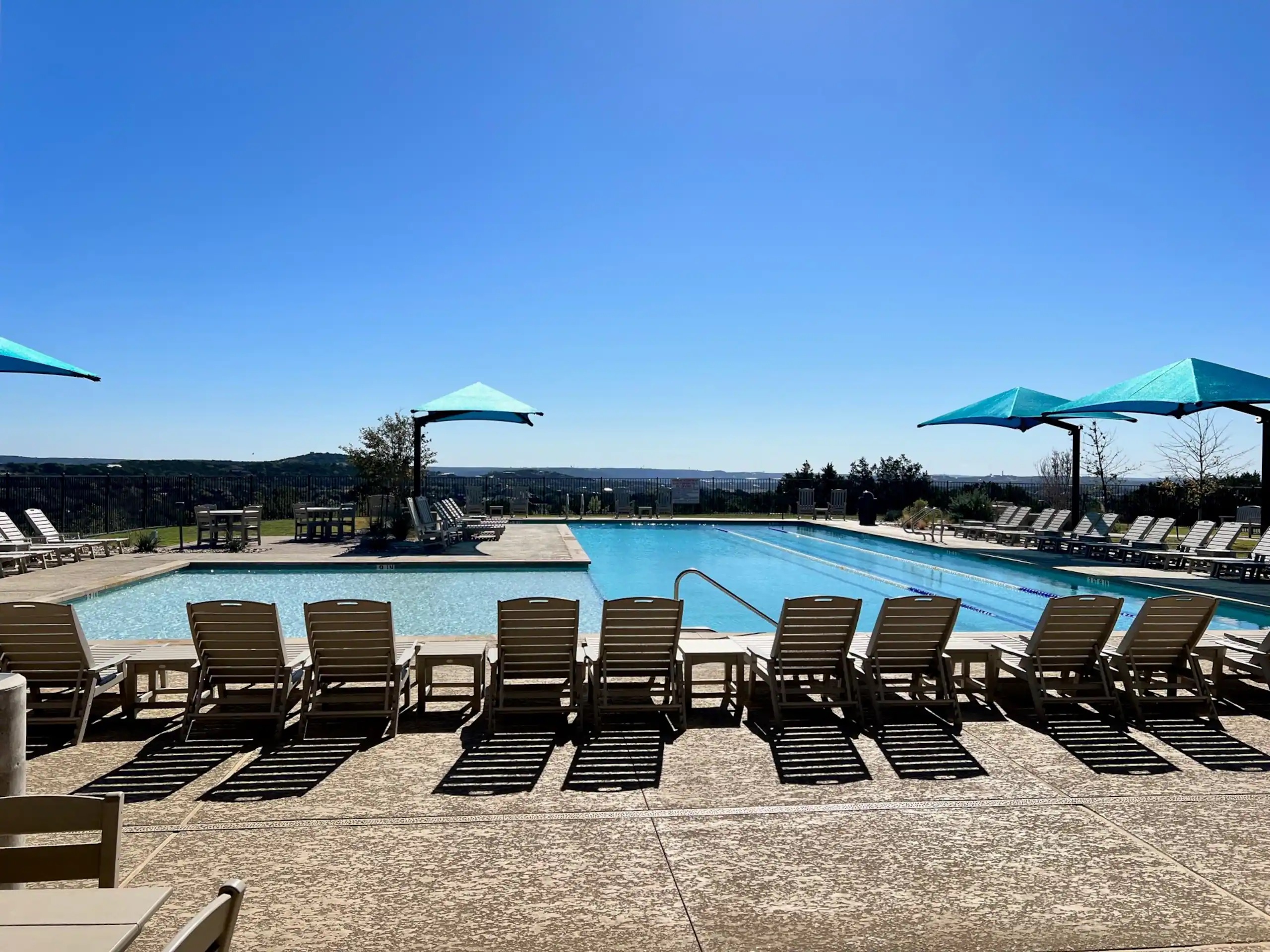 
Trailhead Club features a lap-style pool, shaded lounging, playground, basketball, and pickleball courts.