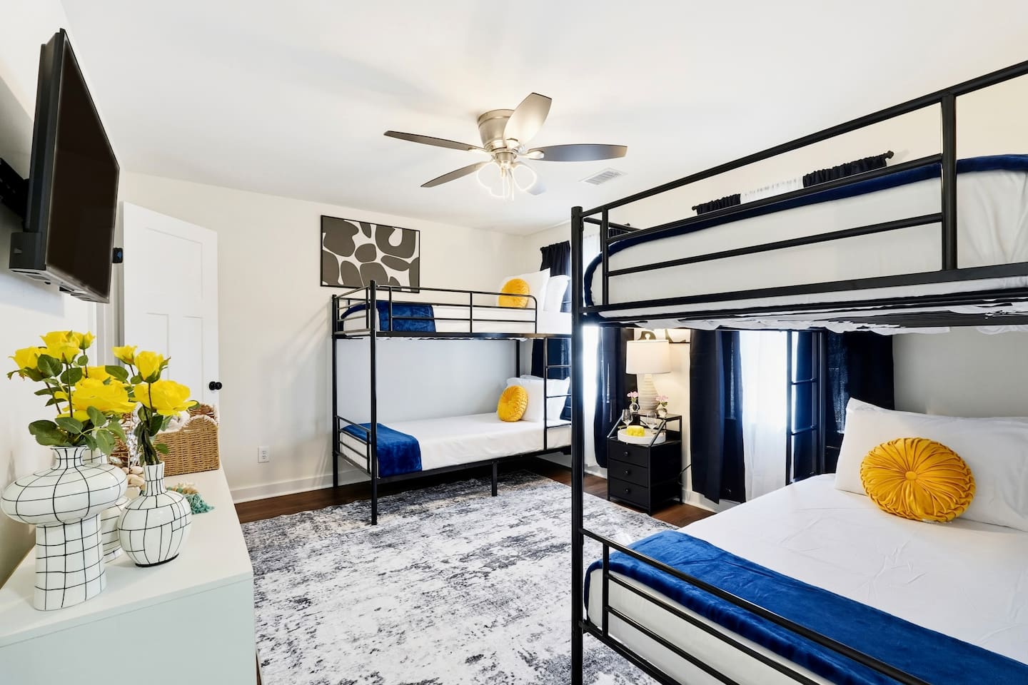 Cozy second-level bedroom with two bunk beds, each with blankets and a Roku TV. First room you see at the top of the stairs. Includes 4 full-body towels, 4 washcloths, and 2 hand towels for your stay.