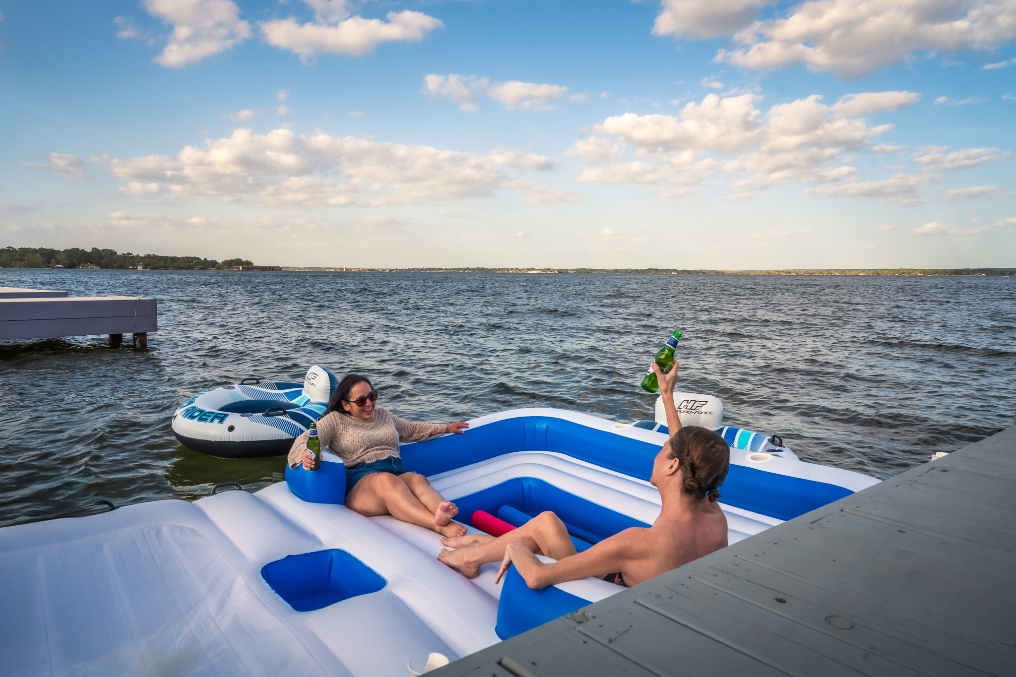 Cheers to lake days done right—cold drinks, good company, and floating without a care in the world.
