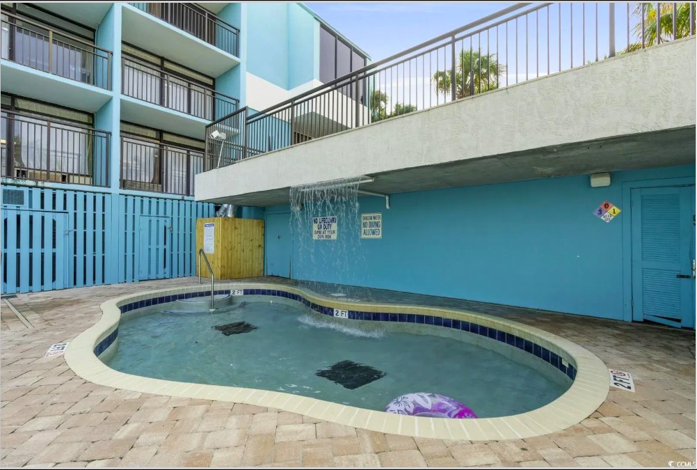 Behold the breathtaking view, where the azure waters of the pool seamlessly blend with the vast expanse of the ocean, creating a true seaside paradise.