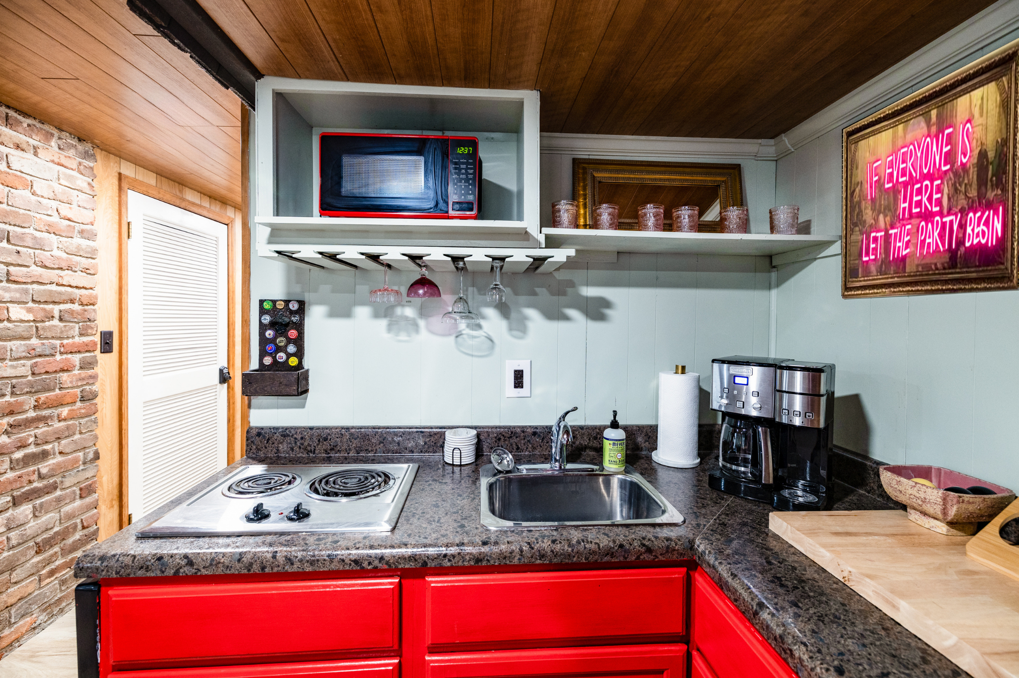 Perfectly situated next to an entertainment area, this space is ideal for preparing snacks and drinks while staying close to the fun and excitement.