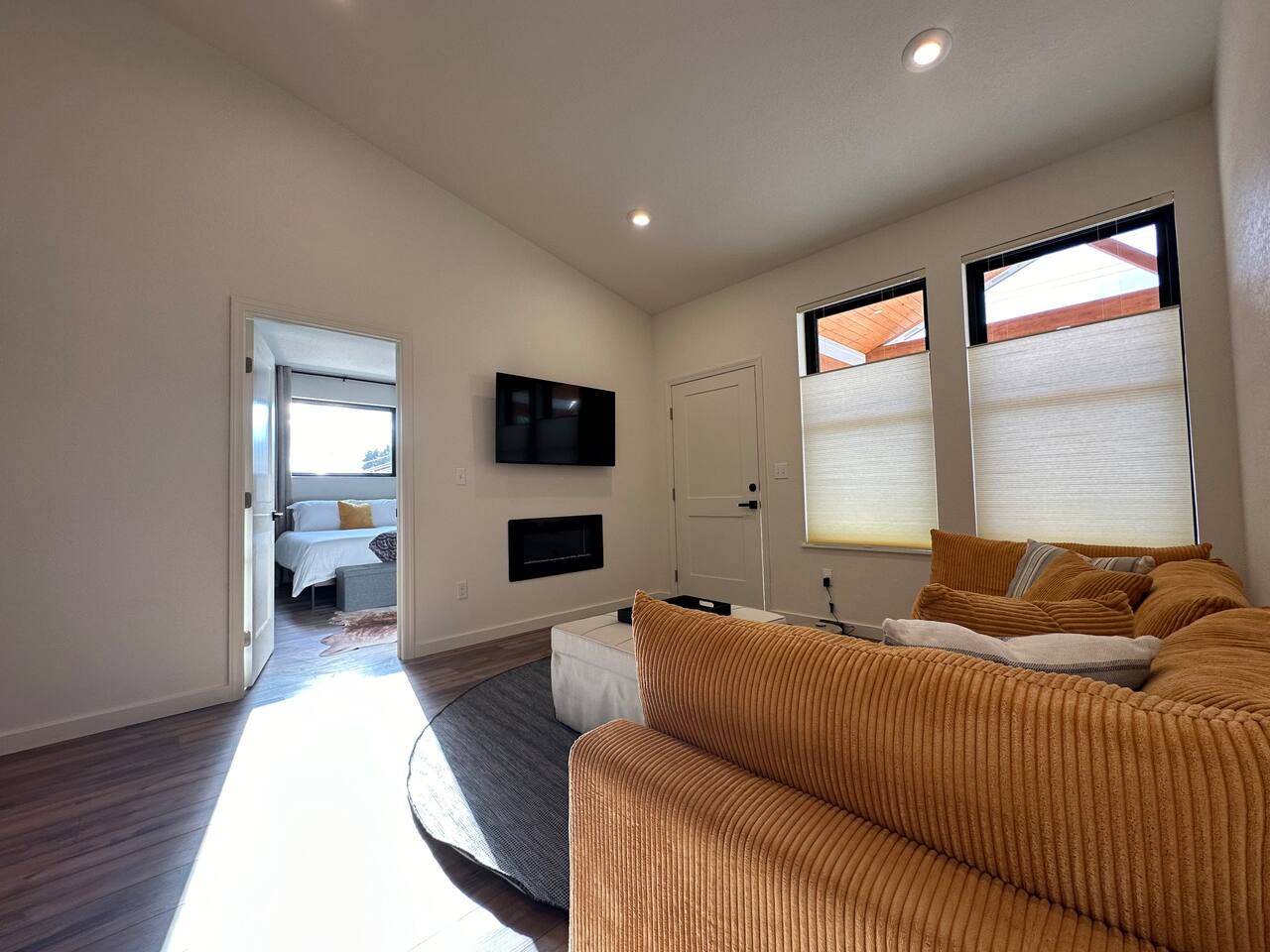 The living room has an electric fireplace with remote.  Two heat settings and a fun variety of flames.   The LG smart TV allows logging into your favorite streaming apps. The mount allow for different viewing angles.