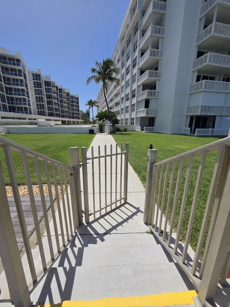 Gate to beach looking at the building