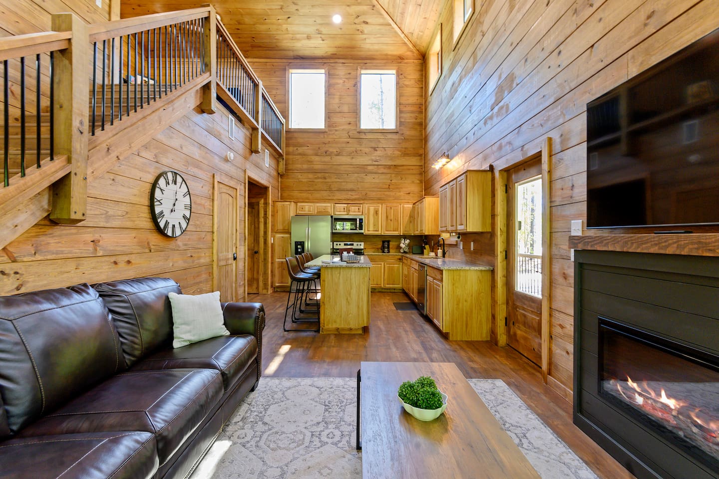 The open-concept design keeps the whole crew connected from kitchen to couch.