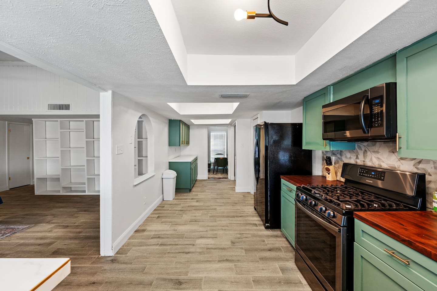 Bright, open kitchen with modern appliances and clean lines—perfect for cooking, entertaining, and staying connected to the group.