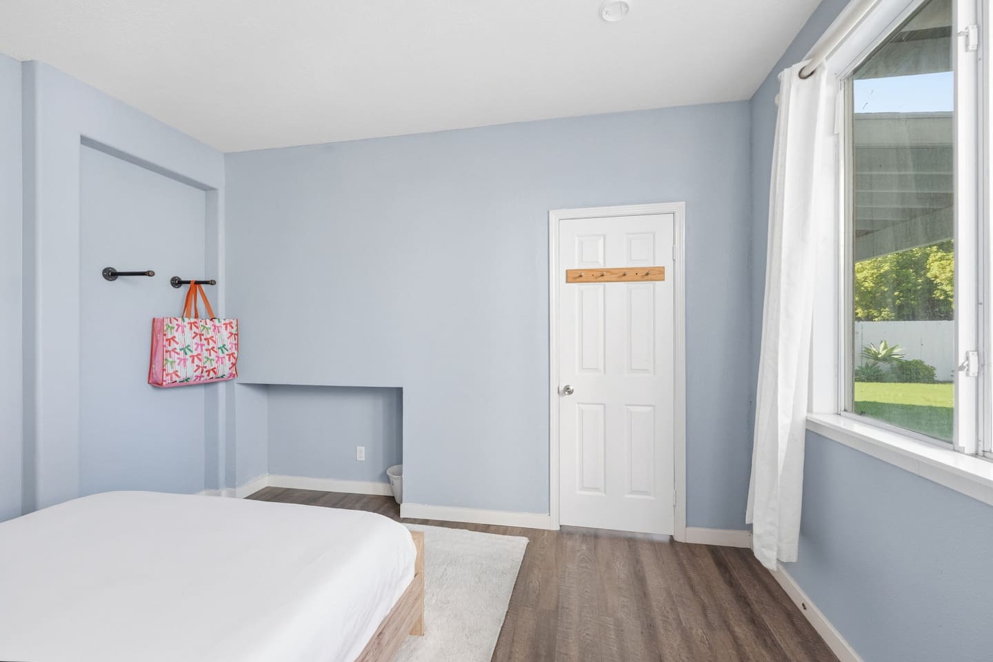 Full bed with fresh bed linens, room-darkening shades, and hangar space. Private, quiet sleeping space for couples or solo guests.