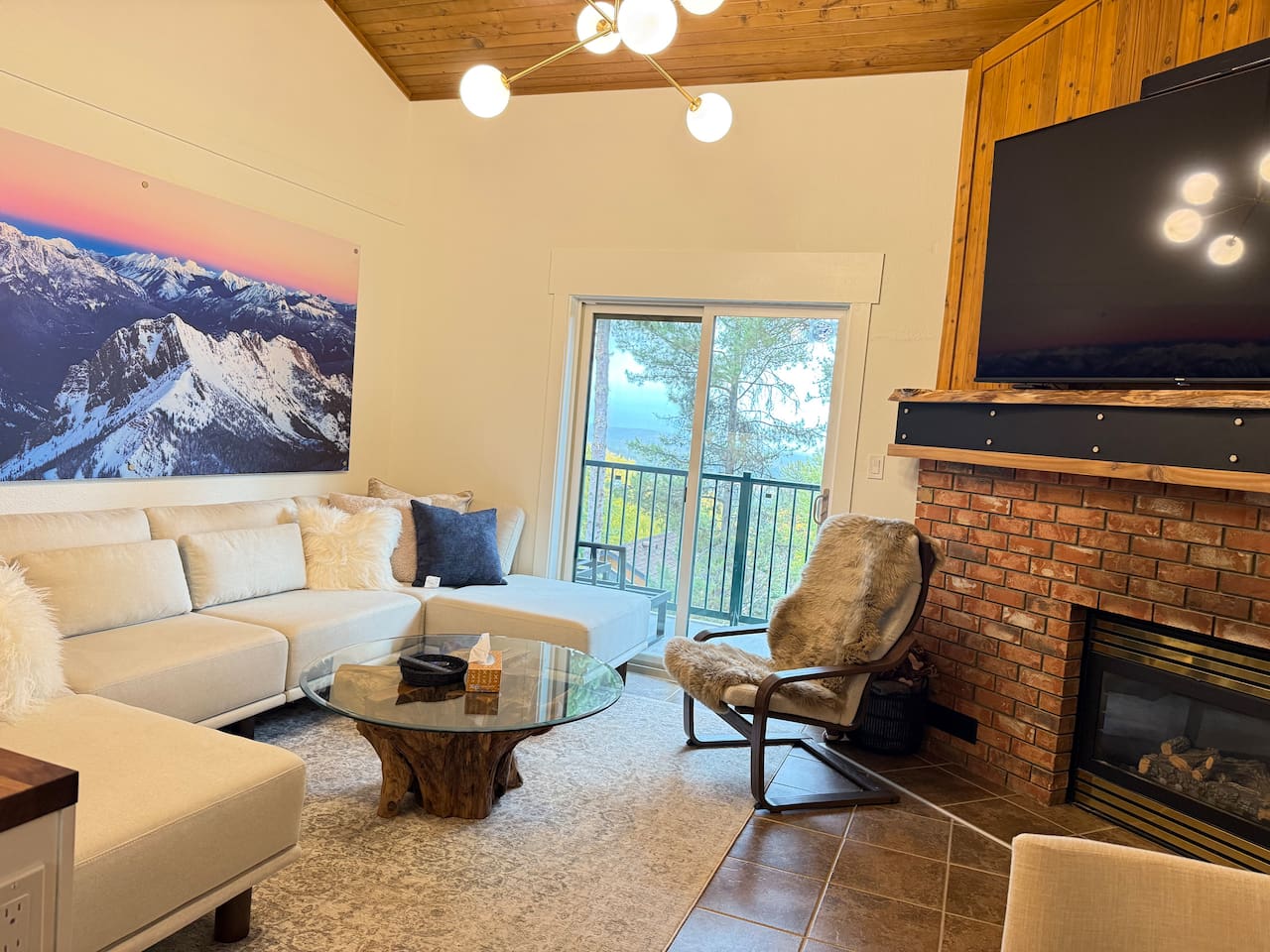 Balcony Access: The living room offers direct access to the private balcony, perfect for morning coffee while overlooking the stunning Rocky Mountains.