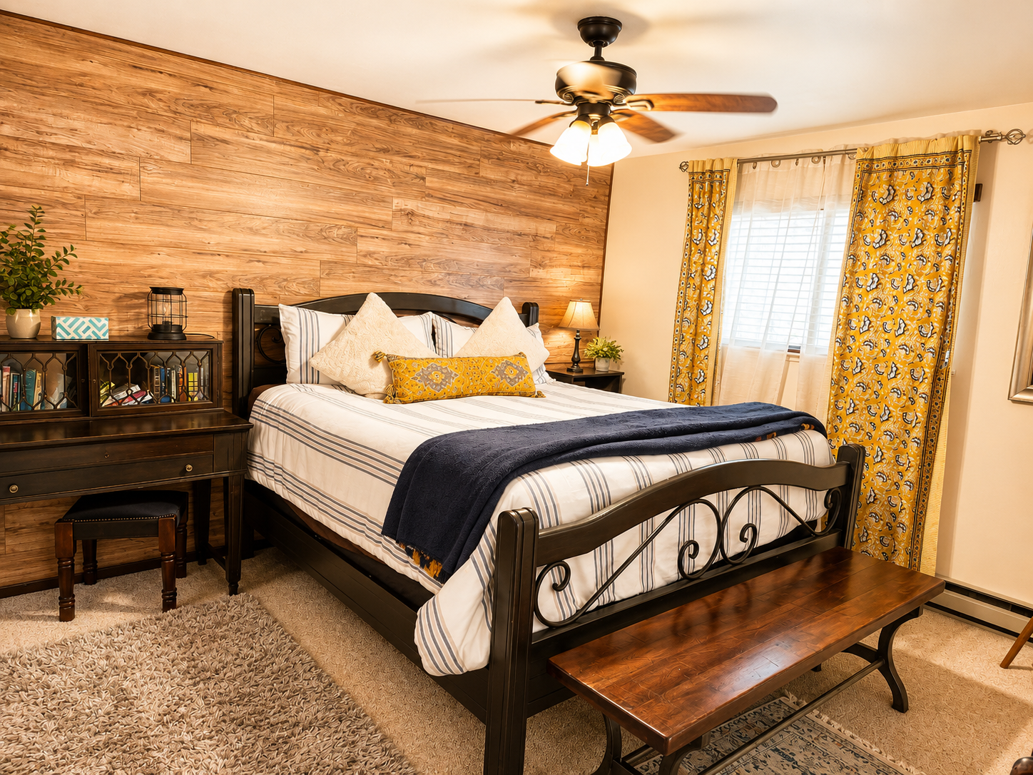 This bedroom is on the 1st floor and has a king size bed, night stands with reading lights on both sides, a closet, Tv with cable, small desk and baseboard heaters.  There is mattress topper on this bed making it SUPER comfy.