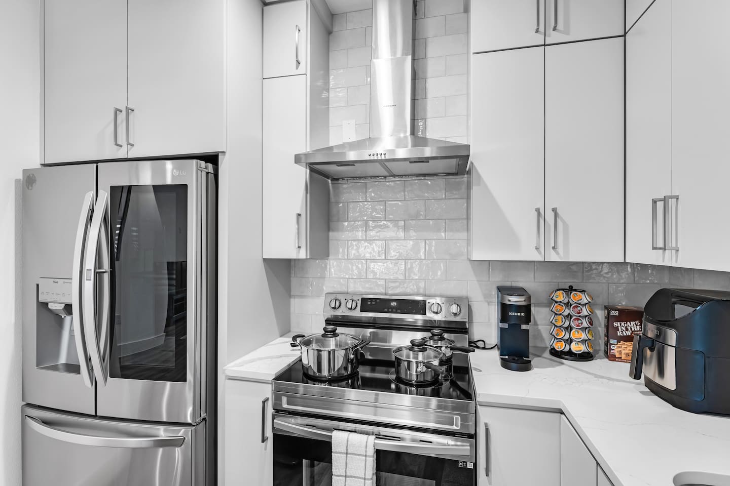Fully stocked modern kitchen with stainless steel appliances and all the essentials.