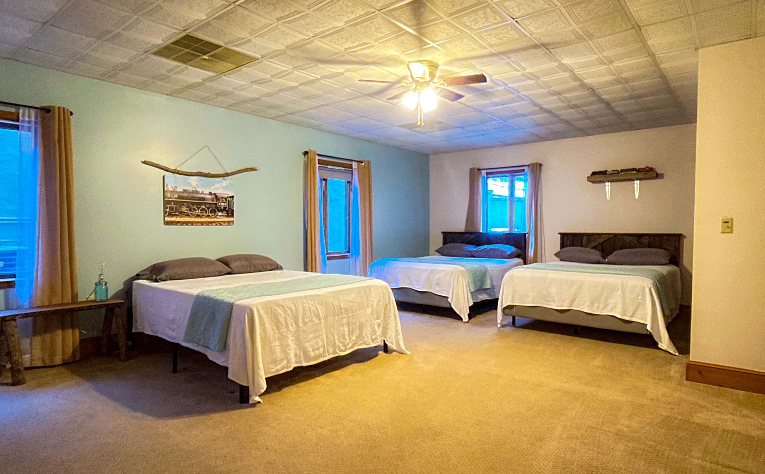 the Great Smoky Mountain Railroad themed bedroom is perfect for kiddos:) Lost of space as well even with 3 queen beds!