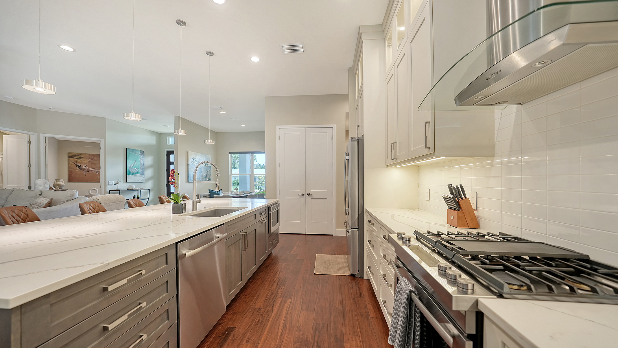 Alternate view of kitchen with top-of-the-line Jenn-Air gas stove, oven, and drawer microwave