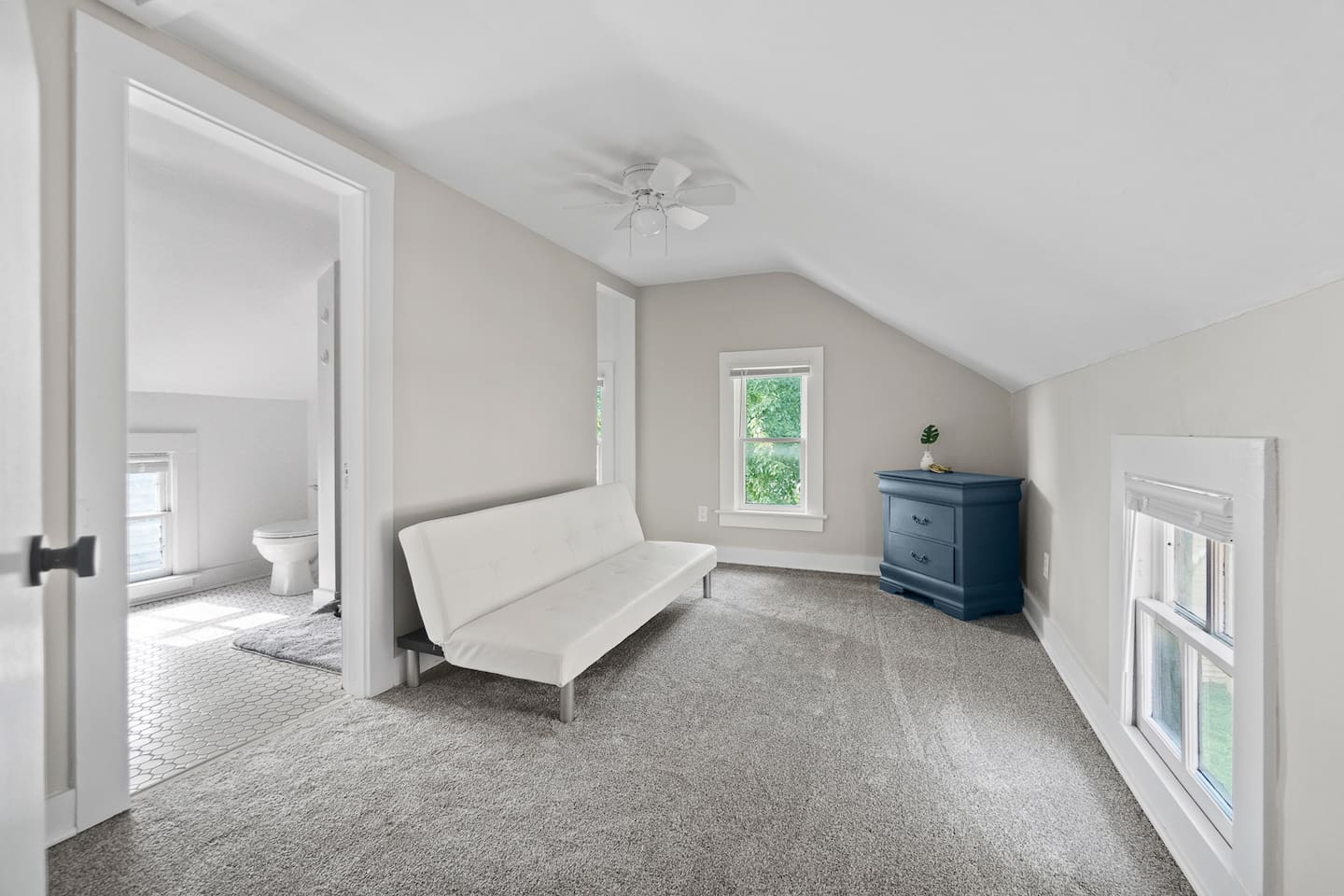 Convenient sofa bed located near the bathroom, offering extra sleeping space with easy access to the restroom for added comfort and flexibility.