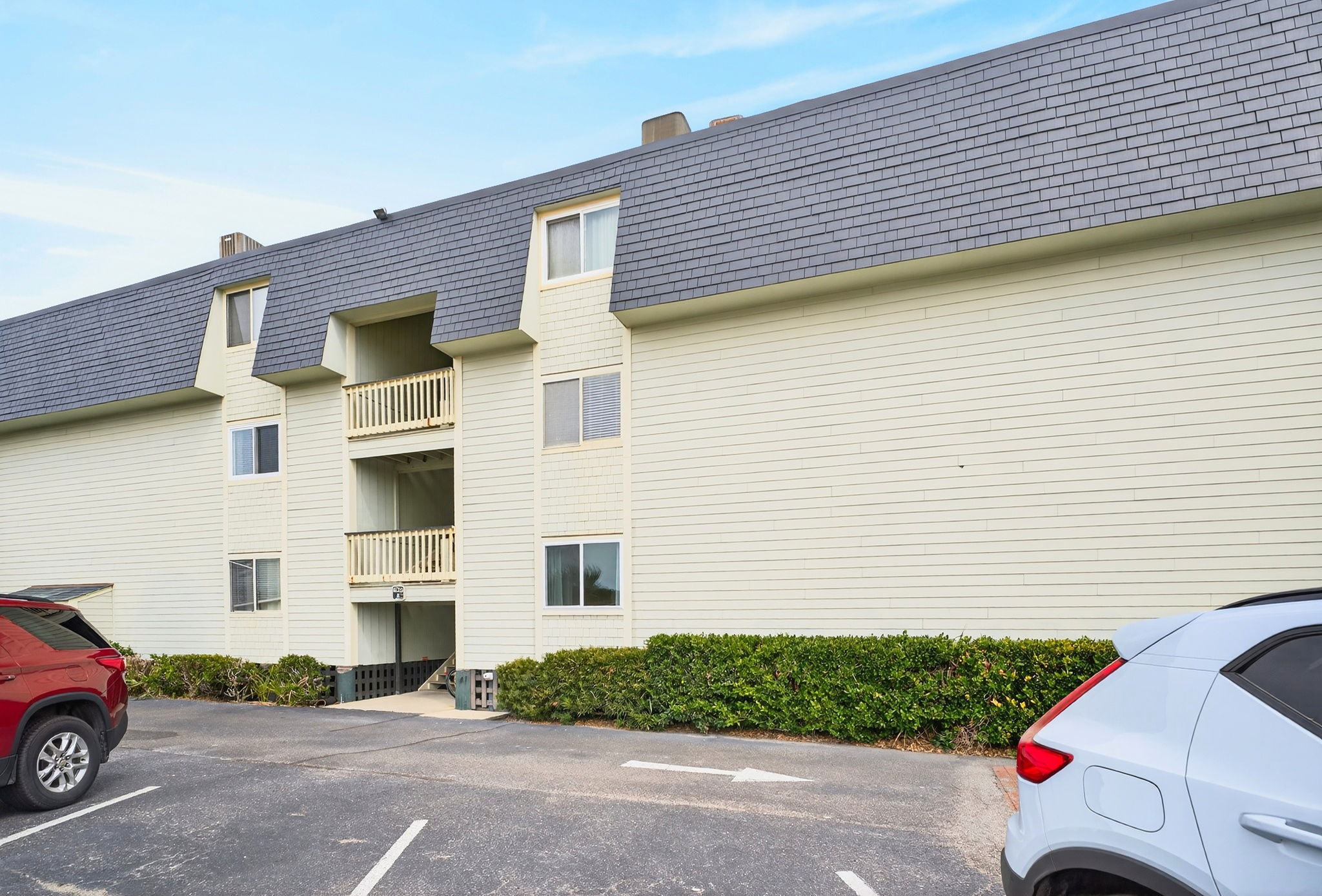 Exterior of Building | Beach Break | IOP Escapes Vacation Rentals | 1400 Ocean Blvd 106B, Isle of Palms SC