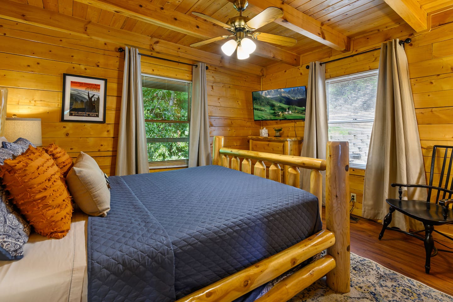 Main floor bedroom with queen size bed and 43" smart tv. 