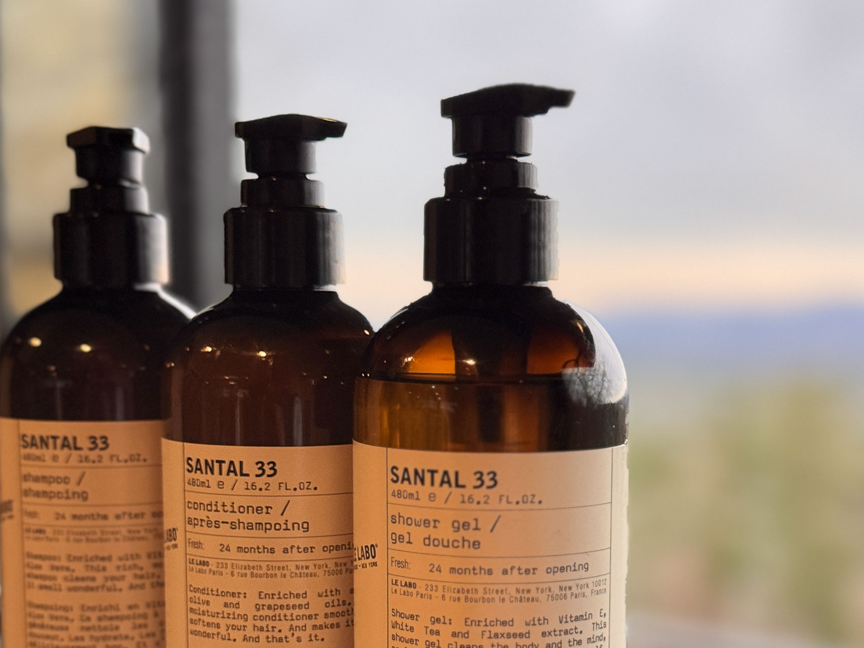 Primary Suite shower amenities &mdash; Le Labo Santal 33 small-batch products