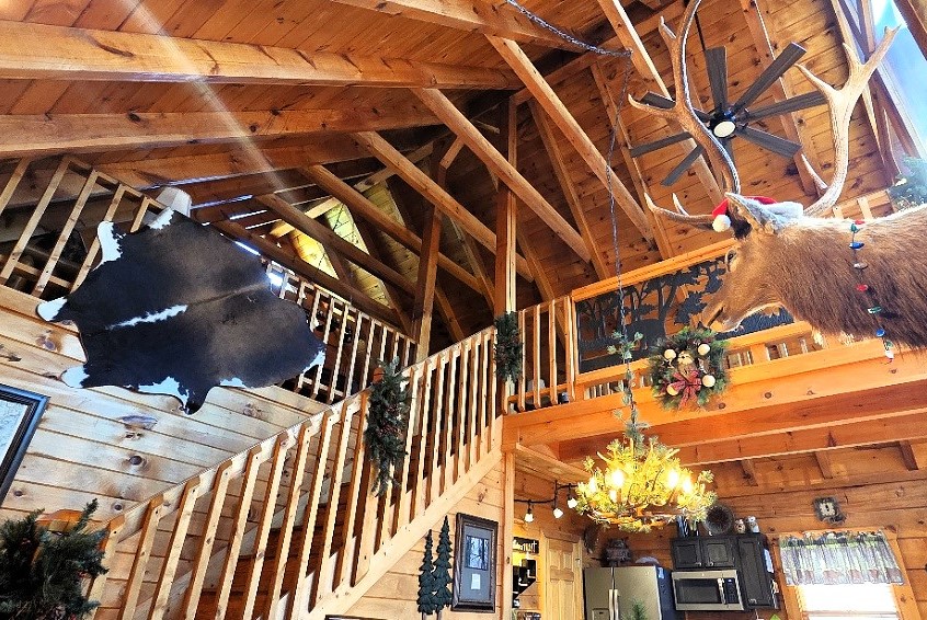 Step inside soaring cathedral ceilings, exposed beams, and authentic mountain lodge charm.