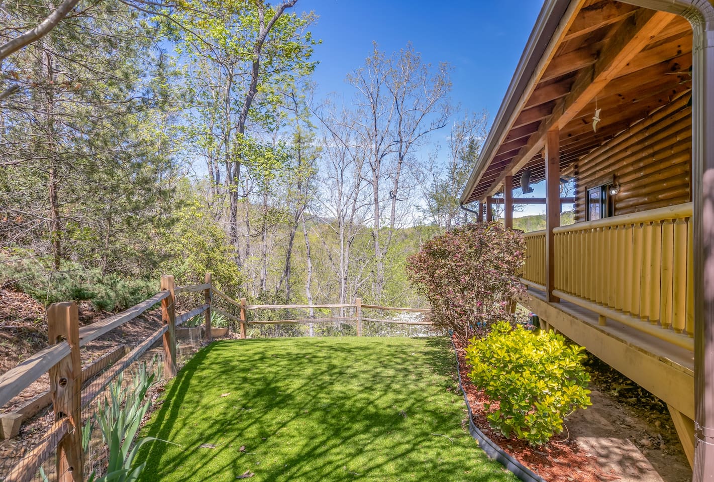 Large fenced in yard with pet-safe artificial turf- holds dogs 25 pounds or less