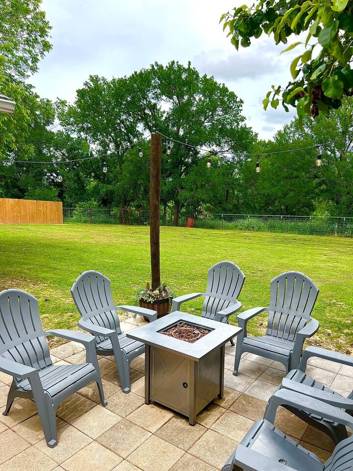 The spacious backyard and patio provide ample room for outdoor gatherings, relaxing, or playing games.