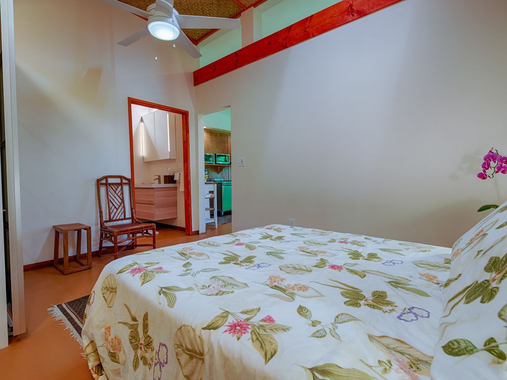 View from the Bed facing the  bathroom to Lft and the Living Room on the Right