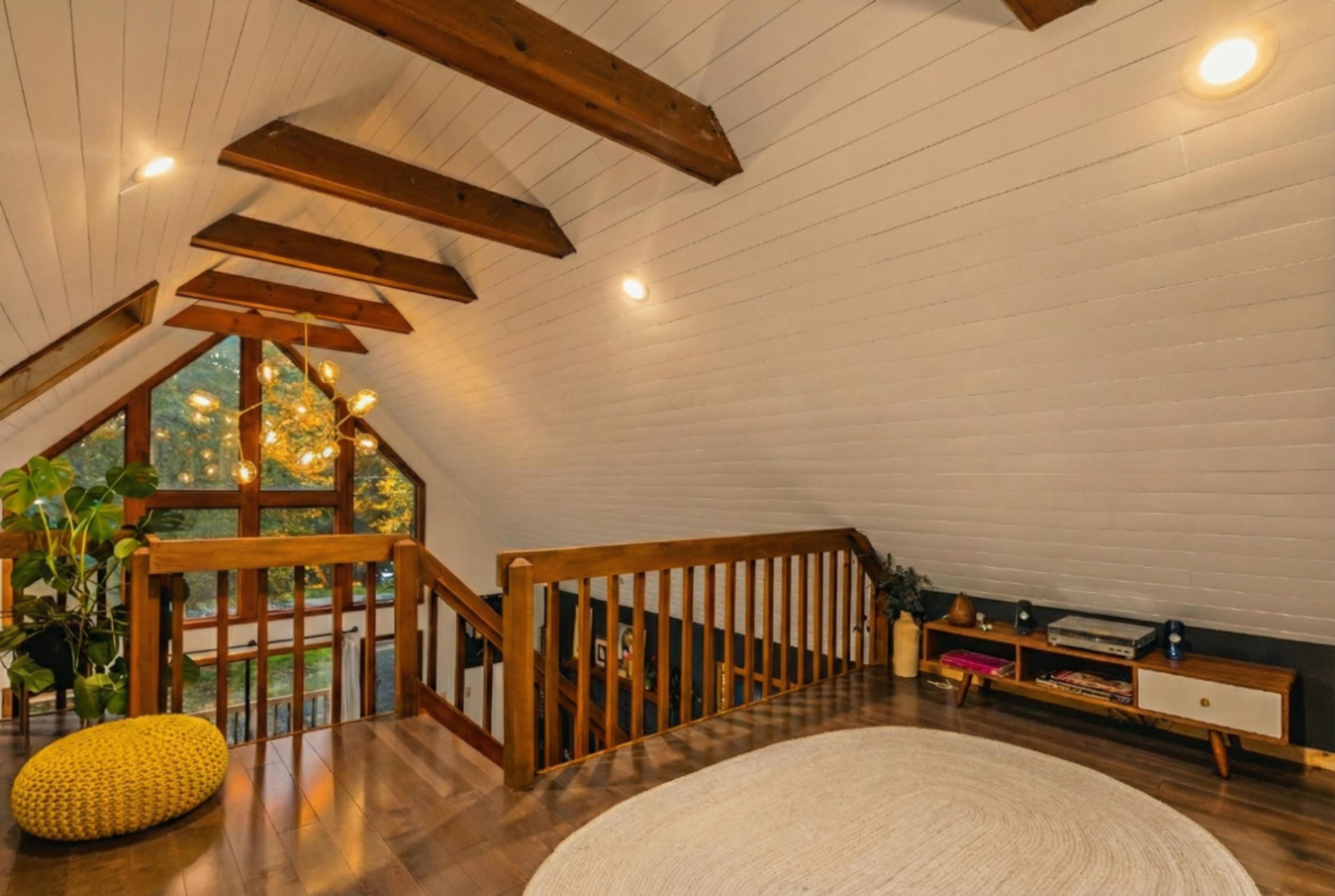 Upstairs loft area - open to below, but perfect for Yoga, listening to records, hanging out, or additional sleeping w/private bathroom and shower