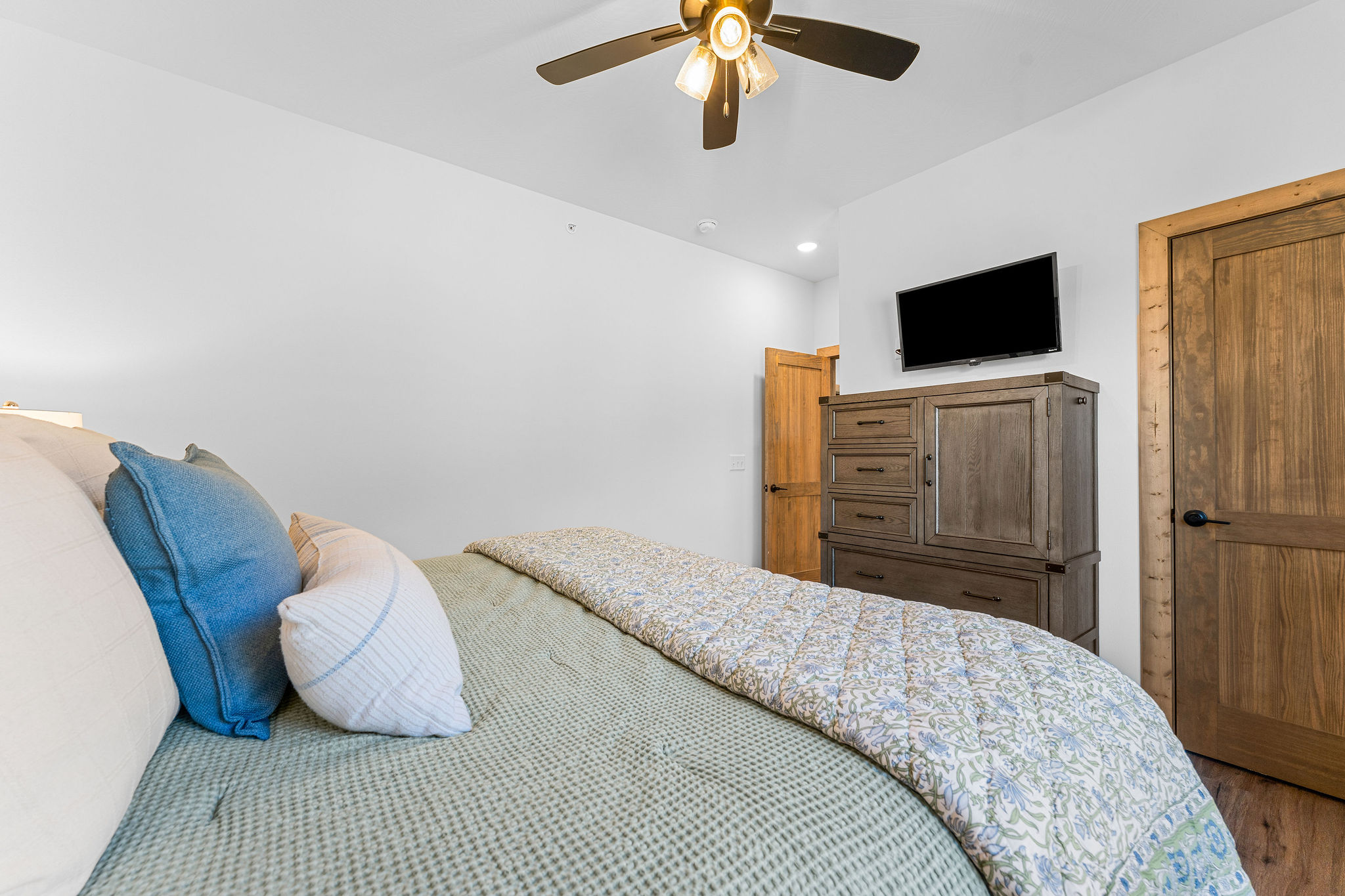 Another comfortable bedroom with TV and plenty of storage.