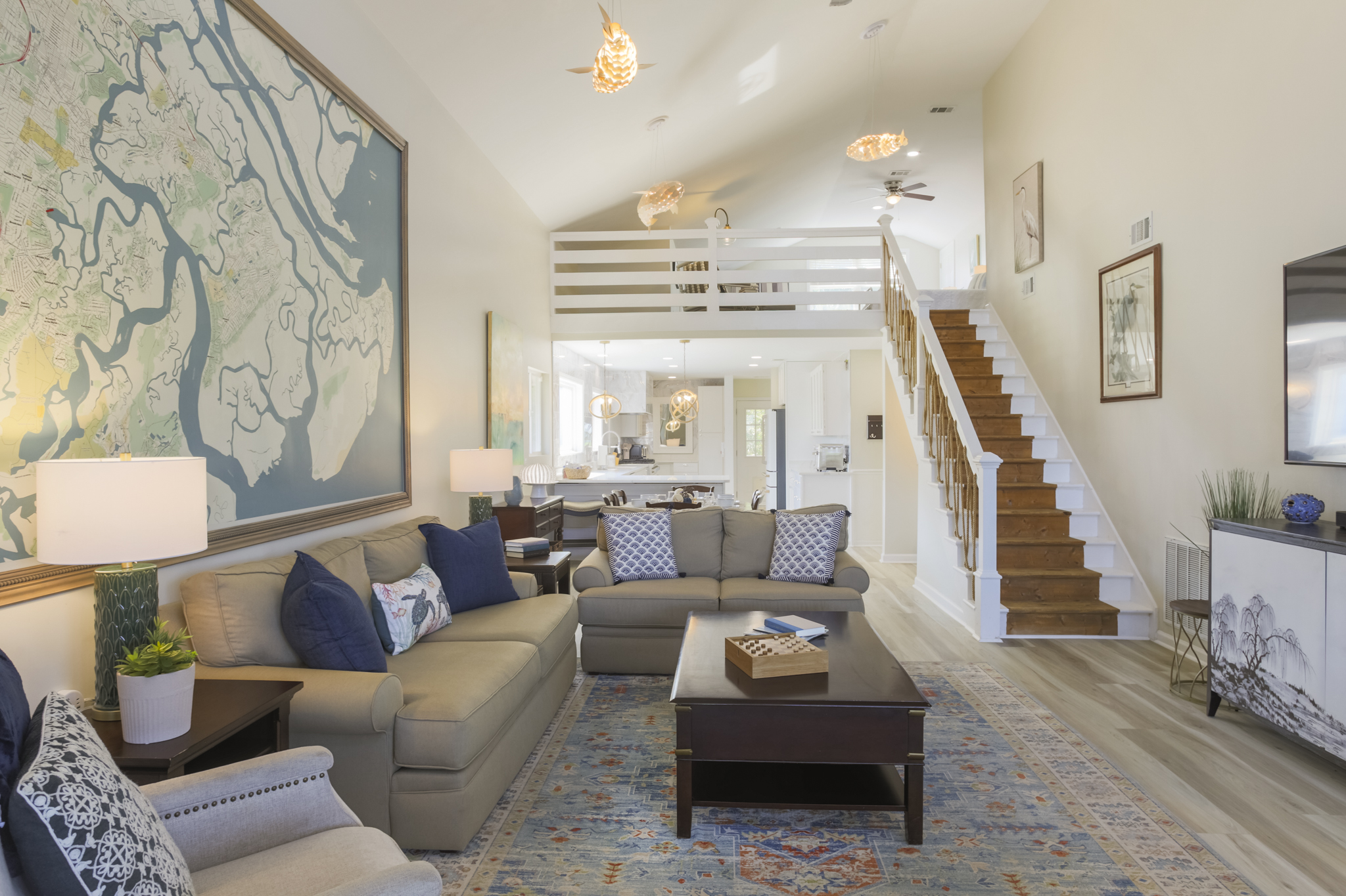 Bright and open living space with cozy seating, perfect for gathering together.