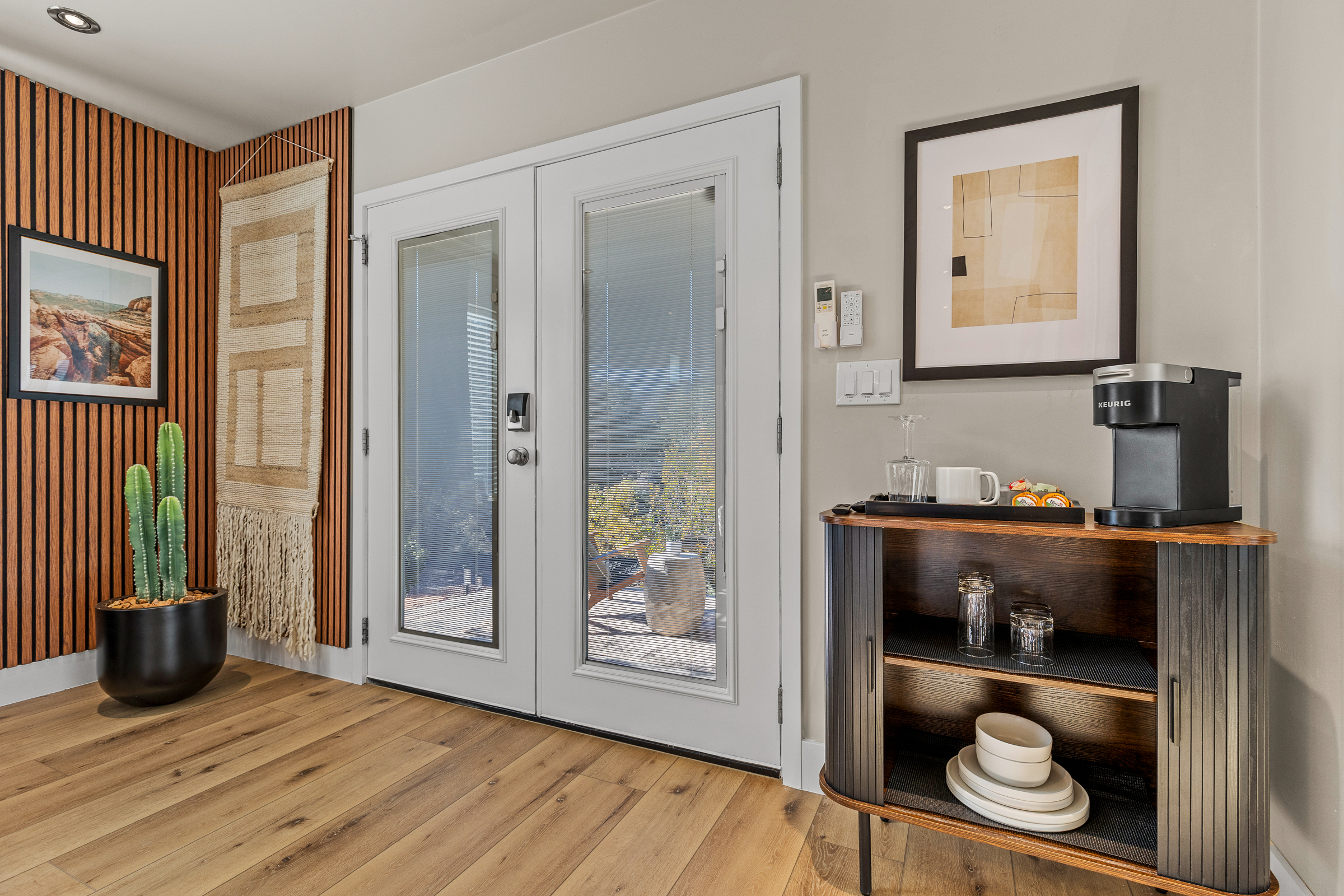 Guesthouse entry with private patio access, in-room coffee station, and easy indoor–outdoor flow for relaxing Sedona mornings and evenings.