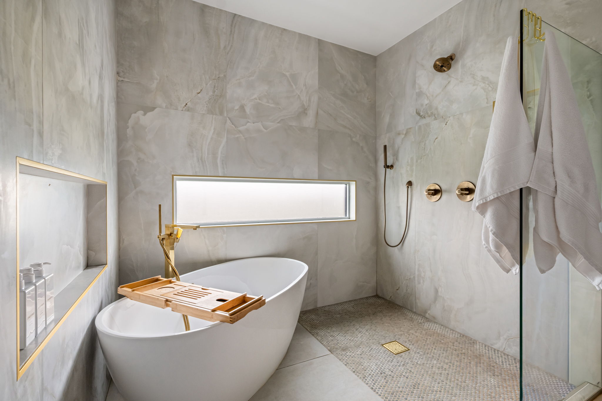 Spa-inspired bathroom with freestanding tub and walk-in shower