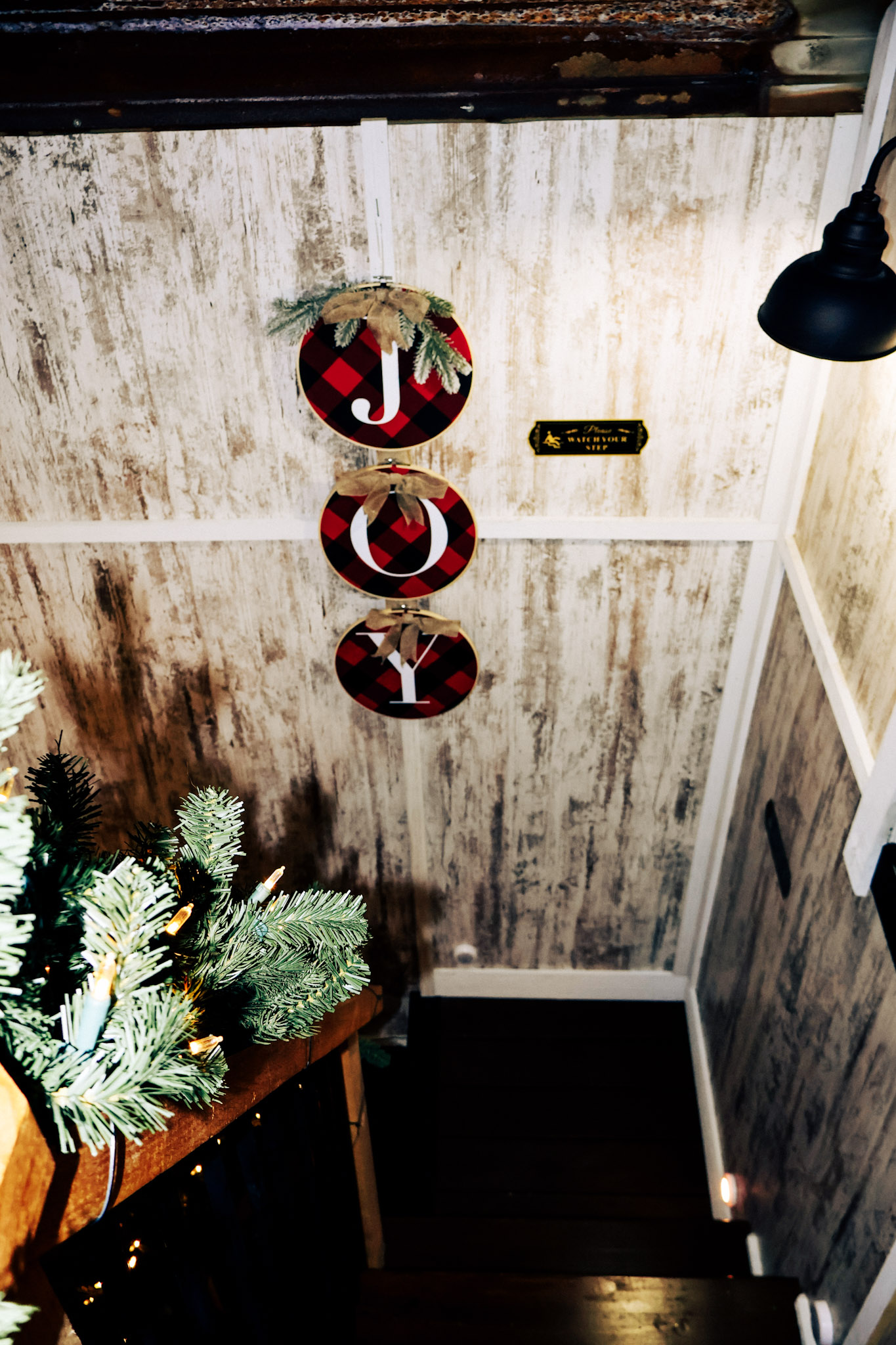 The stairs down from the bedroom loft