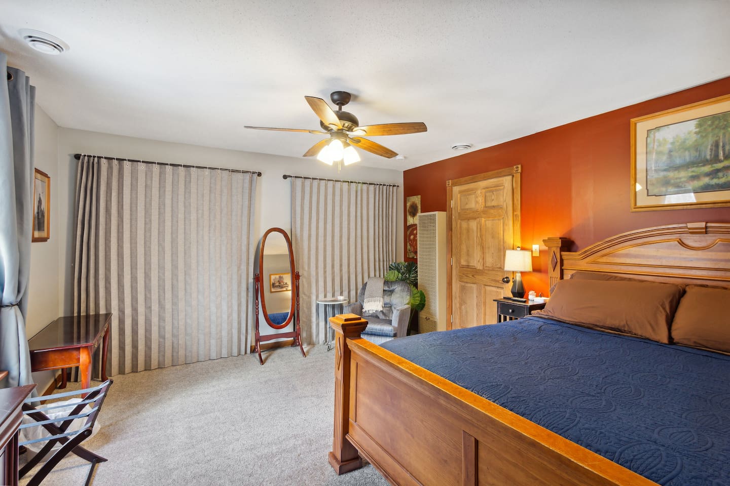 Full size mirror and table for more belongings. 2 large closets behind new curtains.